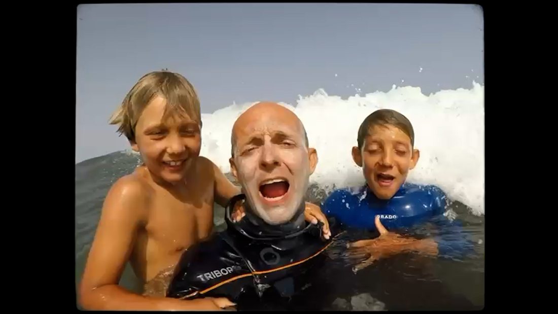 Father and sons in the shore break, home footage