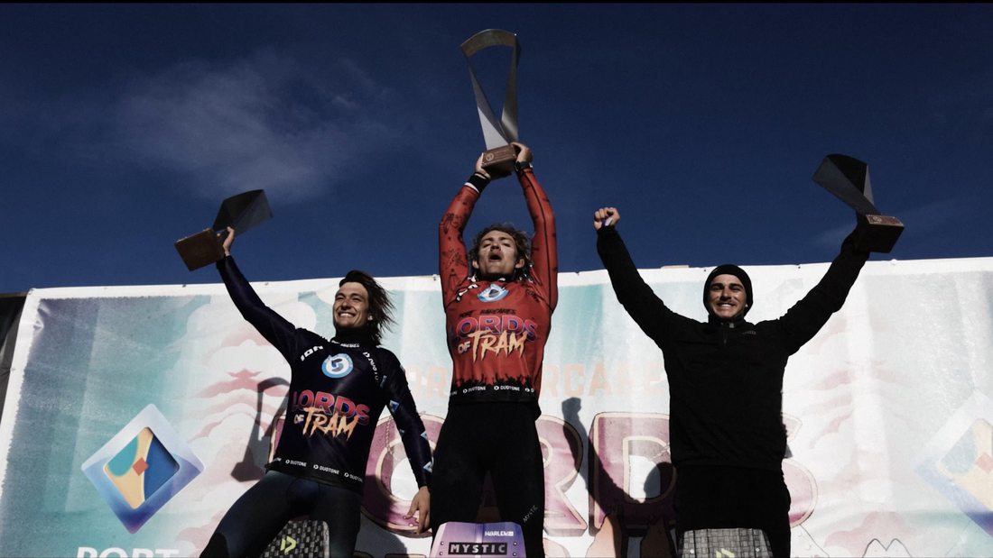 On the podium, trophies up